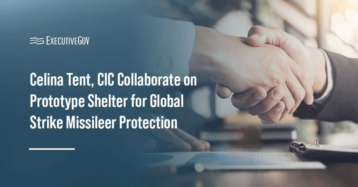 A photo of a handshake. Celina Tent and the Cyber Innovation Center developed a prototype shelter for missile maintainers