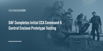 Air Force personnel working with a computer. The department hosted a prototype demo of the Collaborative Combat Aircraft C2 Enclave.